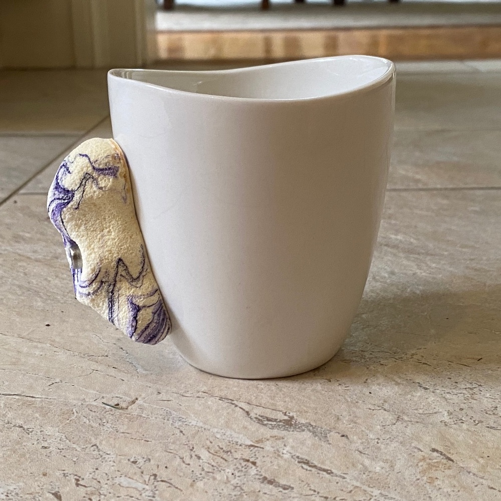 Mug with climbing hold handle